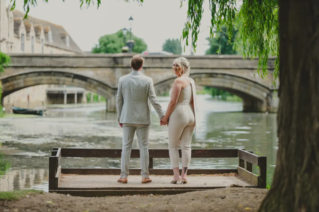 Couple on a stone bridge over a river