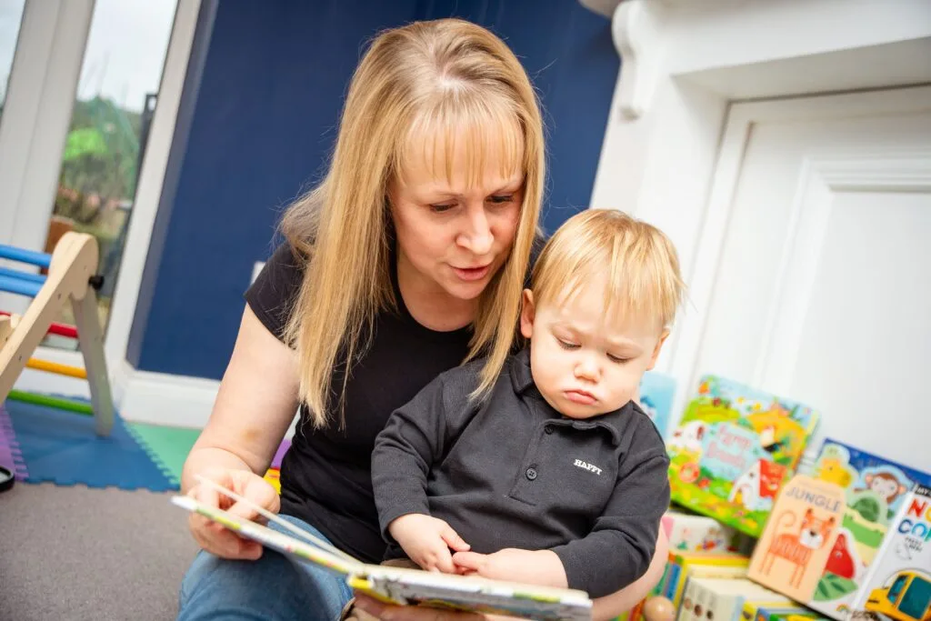 Mum reading a book with her baby