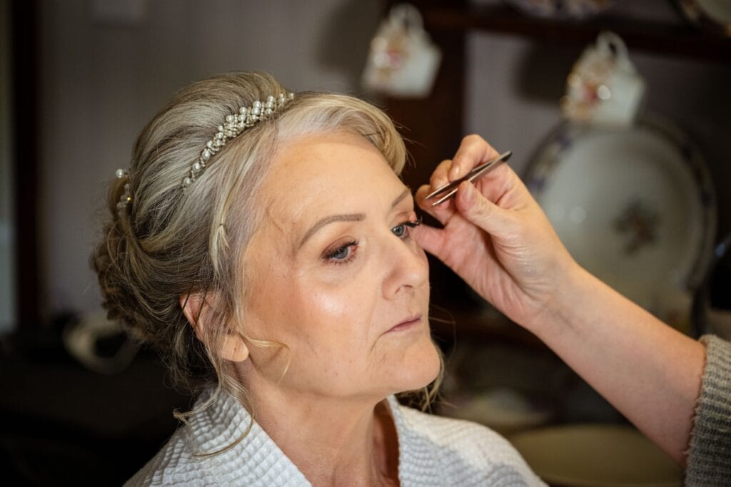Bride having her make-up finished