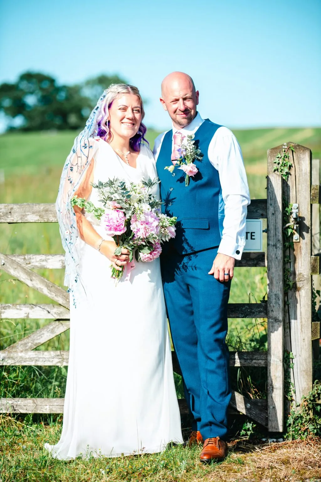 Couple portrait by a garden gate