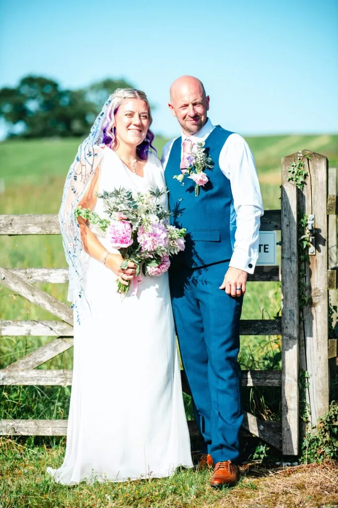 Couple portrait by a garden gate